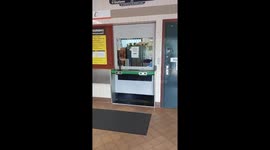 Cat Sitting On Desk At Ticket Window Bit