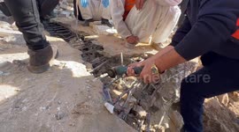 Palestinian Civil Defence Search Bodies