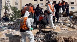 Palestinian Civil Defence Search Bodies
