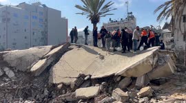 Palestinian Civil Defence Search Bodies