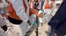 Palestinian Civil Defence Search Bodies