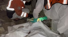 Palestinian Civil Defence Search Bodies