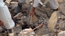 Palestinian Civil Defence Search Bodies