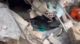 Palestinian Civil Defence Search Bodies