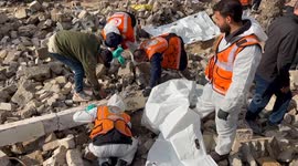 Palestinian Civil Defence Search Bodies
