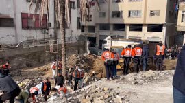 Palestinian Civil Defence Search Bodies