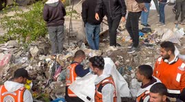 Palestinian Civil Defence Search Bodies