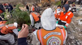 Palestinian Civil Defence Search Bodies