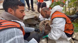 Palestinian Civil Defence Search Bodies