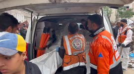 Palestinian Civil Defence Search Bodies