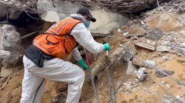 Palestinian Civil Defence Search Bodies