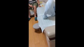 Amusing moment pet dog struggles in onesie pyjama