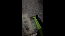 Frozen windshield scraped on chilly winter morning in Gray, Kentucky, USA