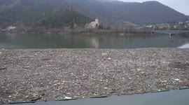 Volunteers clean waste accumulated at Ruzin Dam in Slovakia