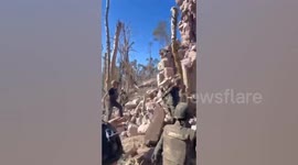 Thai soldiers hoist flag on ancient temple captured on disputed border with Cambodia