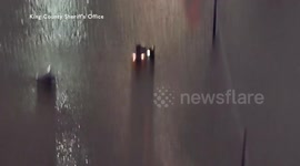 Rescue teams save driver as catastrophic flooding persists in Washington