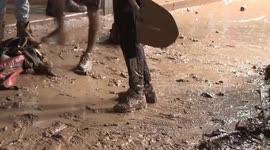People work together to remove traces of deadly flood in Safi, Morocco