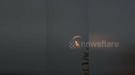 Flying Santa Soars Over Town Square to Delight Holiday Crowds