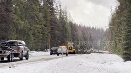 Road crews worked to clear downed trees and power lines from Highway 83 after a storm brought damaging winds to the area