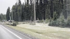 Utility crews work to repair downed power lines after a storm brought high winds to parts of Montana