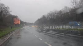 Heavy Rain hits the South West in Plymouth Devon No body is slowing down and tailgating on the A38 though Plymouth  even the rivers are bursting its banks and trees are falling