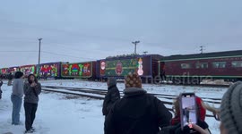 People line up as CPKC Holiday Train Rolls Through Minnesota to Support Local Food Banks