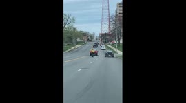 Angry Motorcyclist Kicks Swerving Car