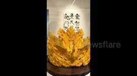 Controversy Erupts: Child's Touch Damages Influencer's Golden Phoenix Crown