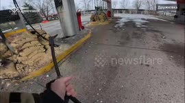 MOMENT - Emergency crews run for cover as second strike hits Druzhkivka