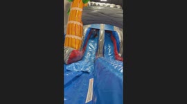 Little Girl Tumbles Down Inflatable Slide