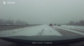 SUV Slides Across Several Lanes During Snowstorm