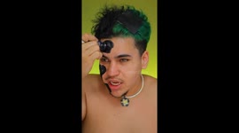 Makeup artist's incredible transformation into metallic beetle