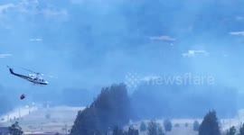 Against the Inferno: Helicopter Battles a Distant Wildfire Up Close