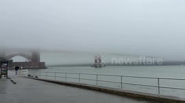 Golden Gate Bridge shrouded in fog during bay area rainfall
