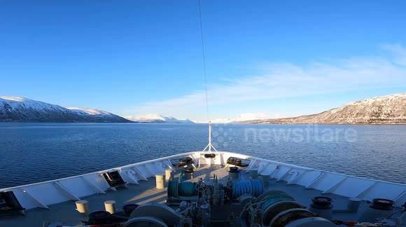 A one-minute boat trip through the Arctic with a general view of the bow. Intense blue sea, clear skies, and the natural sound of the polar north wind. In the background, the icy mountains are beginning their spring thaw.  No editing – pure stable capture