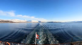 Unique raw footage from the stern of a boat in Norwegian Arctic waters. The wake creates wave interference patterns resembling a Japanese torii gate or the Greek letter π. Natural optical and fluid dynamics phenomenon. Natural sound.