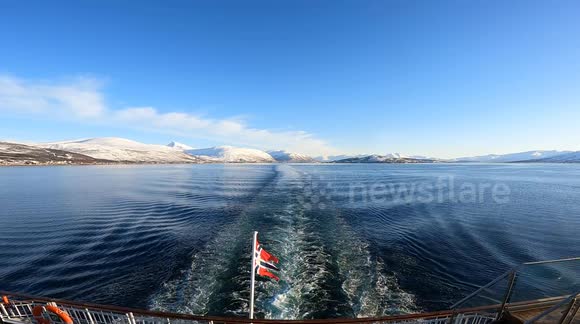 Unique raw footage from the stern of a boat in Norwegian Arctic waters. The wake creates wave interference patterns resembling a Japanese torii gate or the Greek letter π. Natural optical and fluid dynamics phenomenon. Natural sound.
