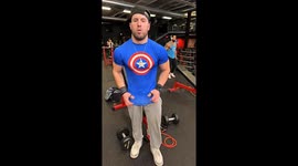 Captain America compression shirt flexes at local gym