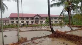School collapses during storm front of shocked teachers in Indonesia