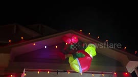 Christmas Grinch inflatable sways as wind pounds homes in Colorado