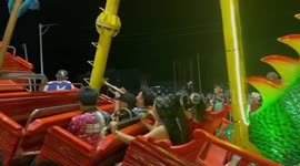 Brass band play Christmas carols as they ride fairground pirate ship