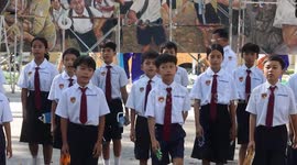 Pupils perform music as artists create peace mural in Siem Reap