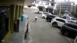 Man trying shoelaces knocked over by reversing van in China