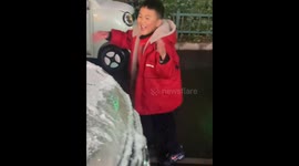 Snowball mishap catches a boy off guard in Anhui, China