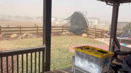 Powerful winds send backyard trampoline flying in Colorado, USA