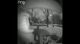Woman slips on stairs during snowy weather in Trevor, Wisconsin, USA