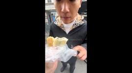 Man reacts to unexpectedly crispy pastry in Jiangsu, China