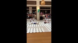 Hilarious moment partygoers struggle to put on boxers using only their feet