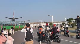 Plane takeoff jet blast knocks over onlookers near Xiamen Airport in Fujian, China