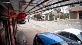 Cars collide at intersection and separate perfectly to avoid hitting pedestrian